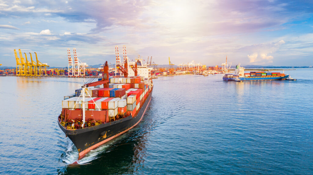 Container ship carrying container for business freight shipping import and export, Aerial view container ship arriving in commercial port.